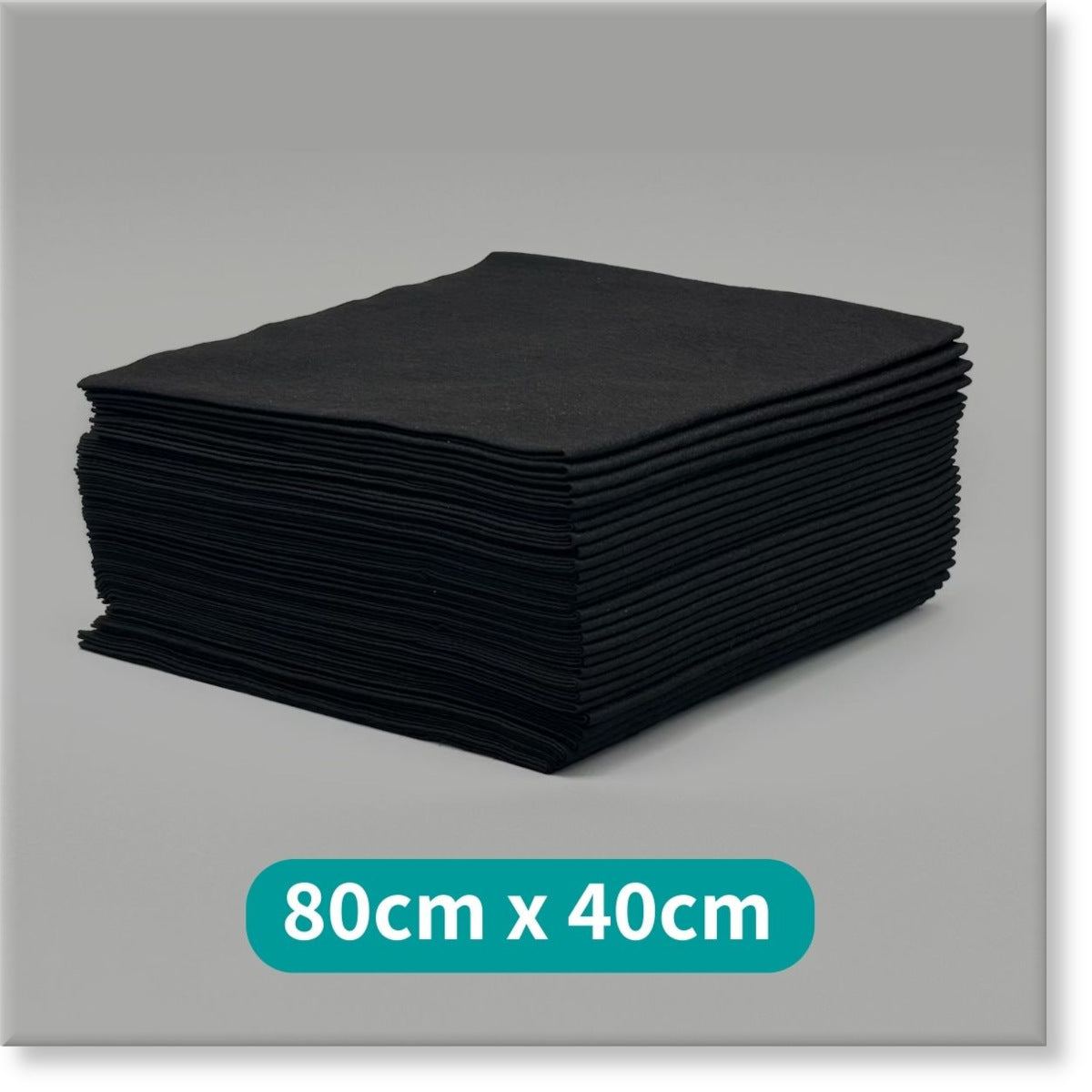 Tunika Salon Towels Image of a large stack of Black Premium Disposable Salon Towels 80cm by 40cm