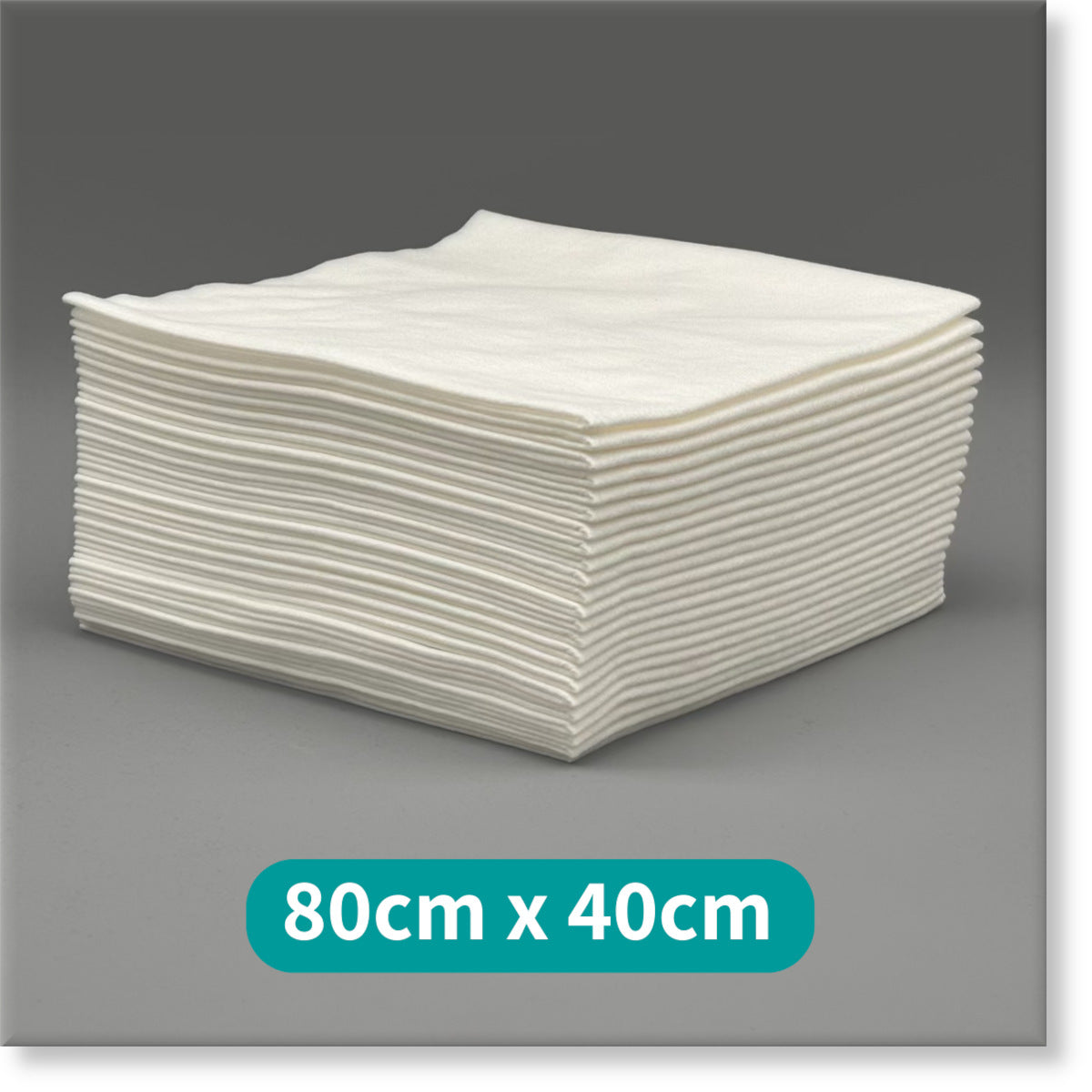 Tunika White Premium Disposable Salon Towels Image showing a large stack of 80cm by 40cm Towels