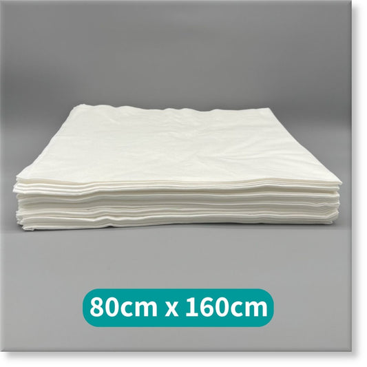 Tunika Disposable Spa Towels Image of a flat stack of Tunika White Premium Disposable Spa Towels 80cm by 160cm