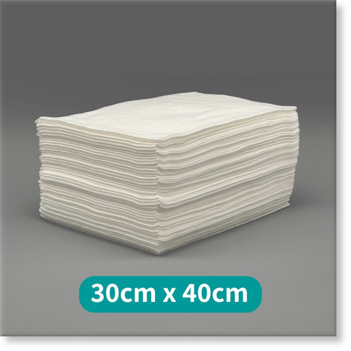 Tunika Disposable Salon Towels Image showing a large stack of 30cm by 40cm Premium White Towels
