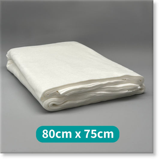 Tunika Disposable Spa Towels Image of a folded stack of Tunika White Premium Disposable Spa Towels 80cm by 75cm A 